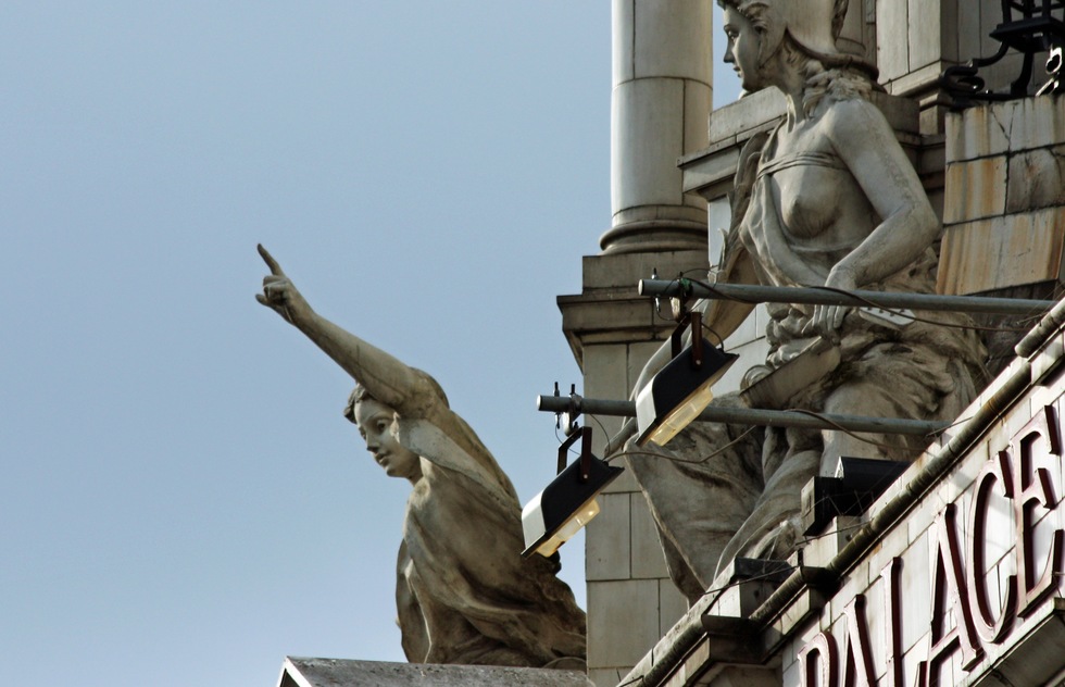 Statues on the Victoria Palace Theatre in London