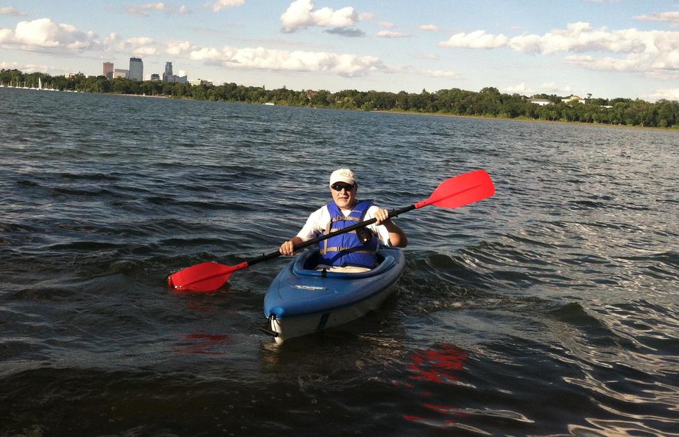 A kayaker takes on one of Minneapolis' 13 lakes