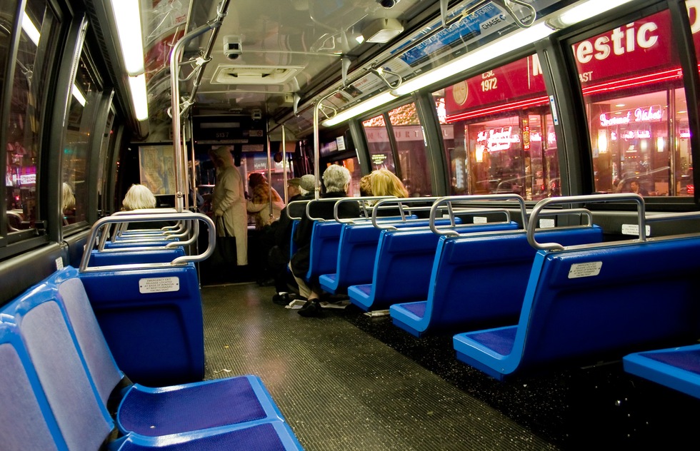 The inside of a New York City bus.
