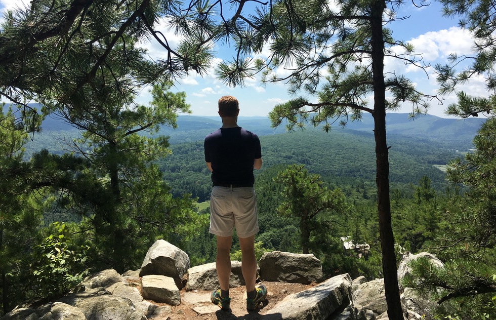 A hiker takes in the views at Monument Mountain, the Berkshires