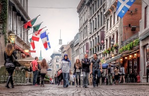 People walk through the Old City of Montreal