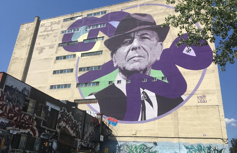 A massive mural of Leonard Cohen is at the heart of the mural district of Montreal