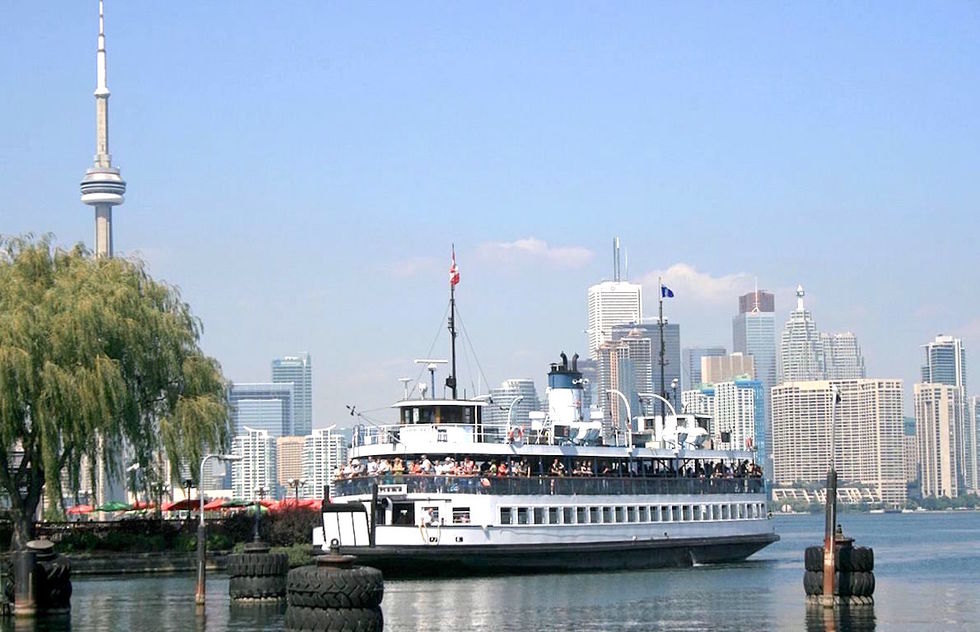 A ferry takes passengers between Toronto's Harbourfront area and the Toronto Islands