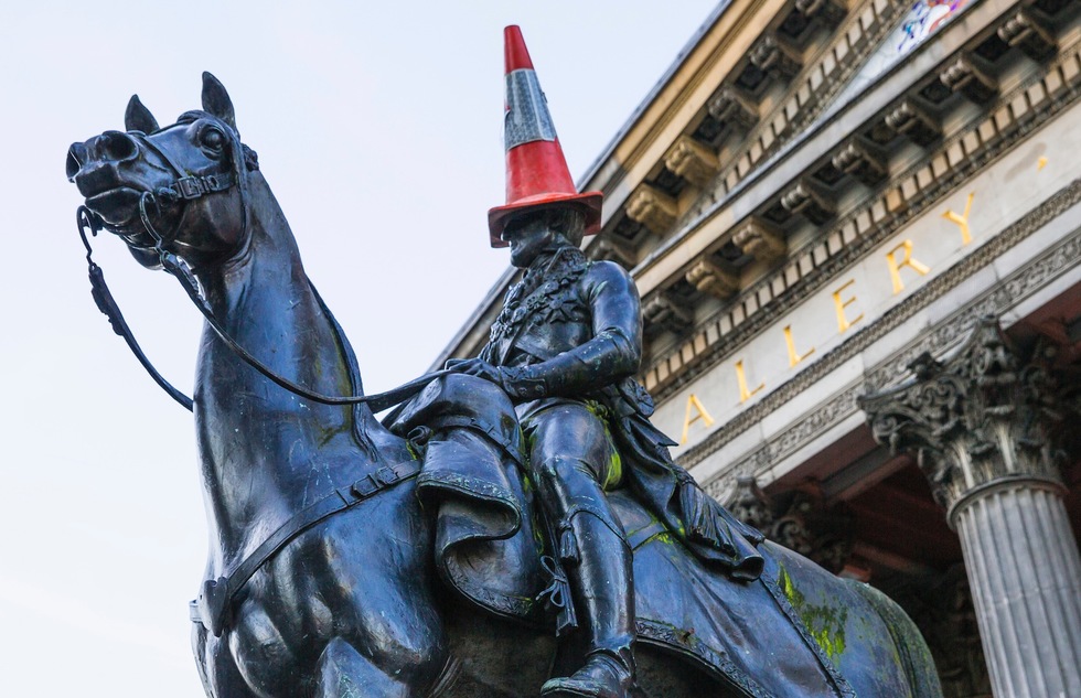 Cone-topped equestrian statue of the Duke of Wellington in front of the Gallery of Modern Art in Glasgow