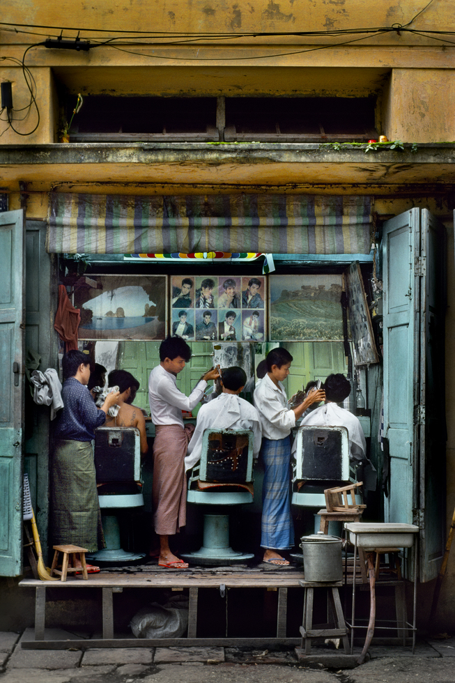 Photography from the book "In Search of Elsewhere: Unseen Images": Barbershop in Yangon, Myanmar, 1994