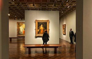 A Rembrandt greets visitors to a gallery on the second floor of the Frick Madison