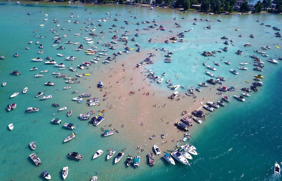Dozens of boats anchored off the south end of Torch Lake