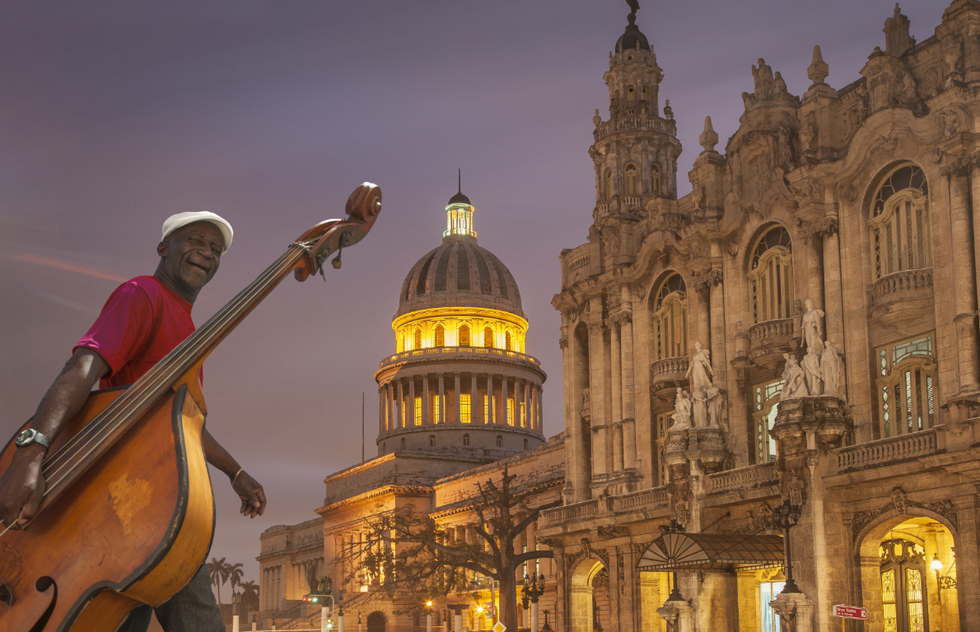 Bass player in front of the Gran Teatro de la Habana in Cuba