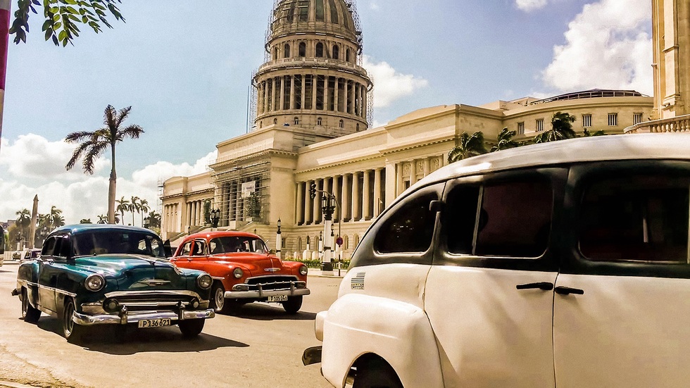 Vintage cars in front of the National Capitol Building in Havana