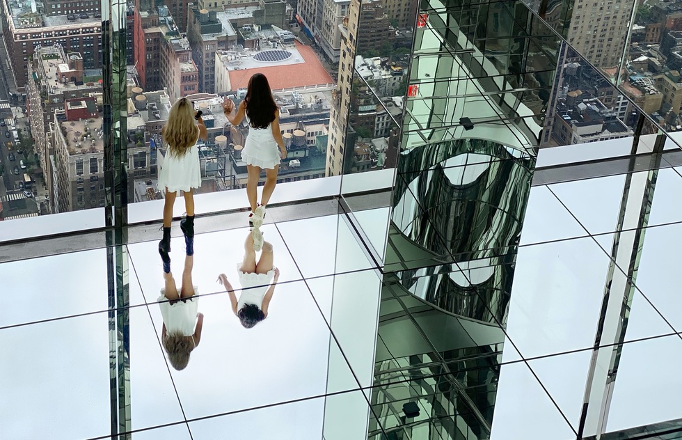 Best way to see SUMMIT One Vanderbilt observation deck in New York City: Two women look out the window of SUMMIT One Vanderbilt