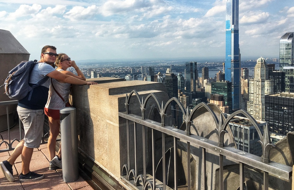 A couple looks at the views from Top of the Rock in New York City
