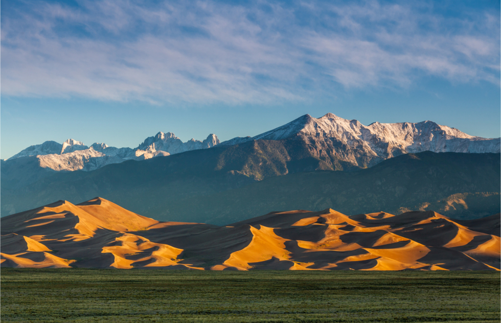 Great National Parks for Spring Vacations: Great Sand Dunes National Park with the Sangre de Cristo Mountains behind it.