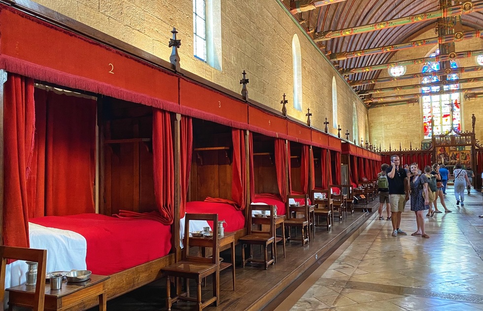 How to tour wineries of the Route de Grand Crus around Dijon, France: A high ceilinged infirmary at the Hôtel-Dieu des Hospices Civils de Beaune in France