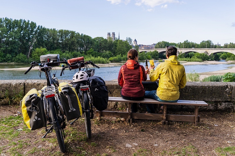 Cyclists with big saddle bags take a break while biking through the Loire Valley