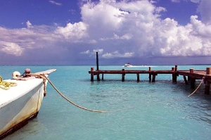 Dock and crystal clear waters in Cancun, Mexico