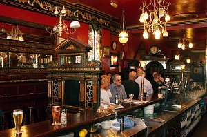 Dubliners enjoy pints of Guinness at pubs like the Long Hall pictured here, Dublin, Ireland