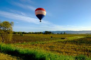 A hot air balloon over Napa Valley vineyards.