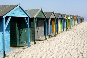 Beach huts on West Wittering Beach in West Sussex, England.