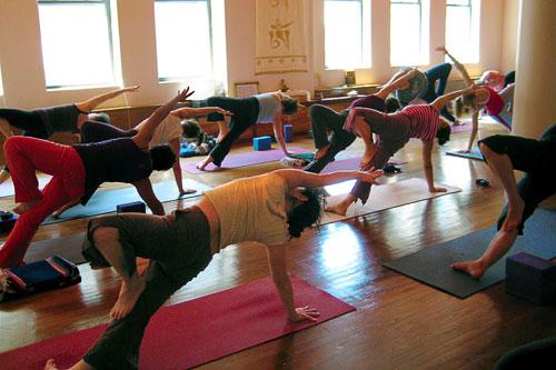 The popular OM Yoga center is filled with light, Buddhist artwork, and dedicated students. Courtesy OM Yoga Center