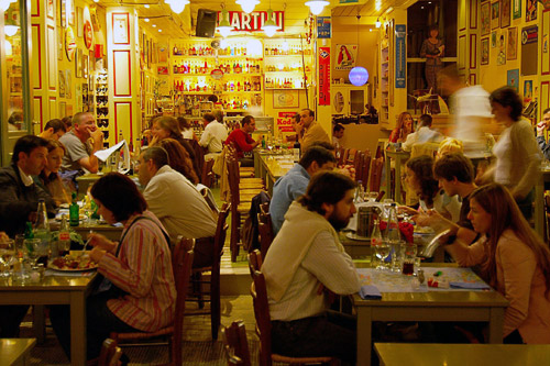 People dining in Psyri cafe at night, Athens