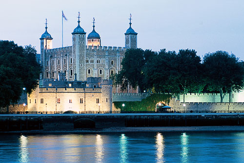 Evening view of the Tower of London, seen from across the River Thames.