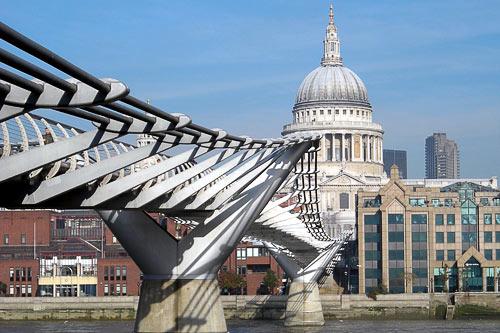 Millennium Bridge stretches over the Thames River between St. Paul's Cathedral and Tate Modern.