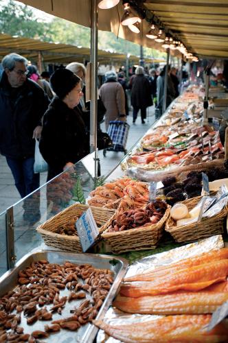 People buying fish from the Marché Rue Richard-Lenoir market in the Bastille area.