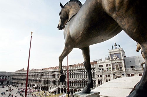Replicas of the original bronze Horses of St. Mark overlook the Piazza San Marco while the original sculpture stand inside the Basilica protected from environmental damage.