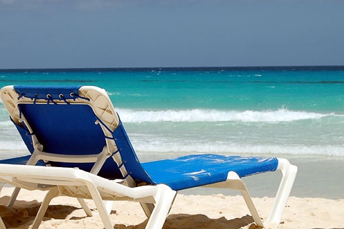 A lone lounge chair overlooking the beach in Antigua