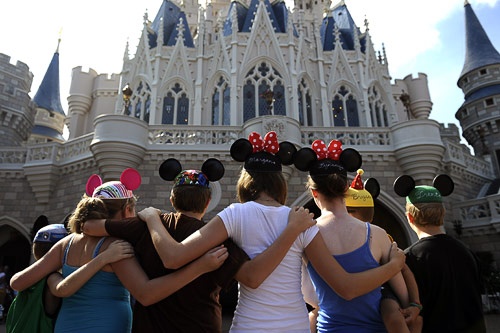 Children at the base of Cinderella's Castle at Walt Disney World