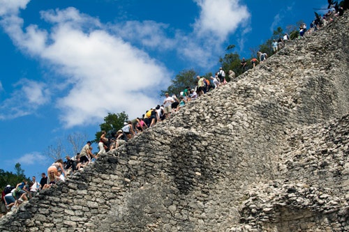 Visitors climb the Coba ruins.