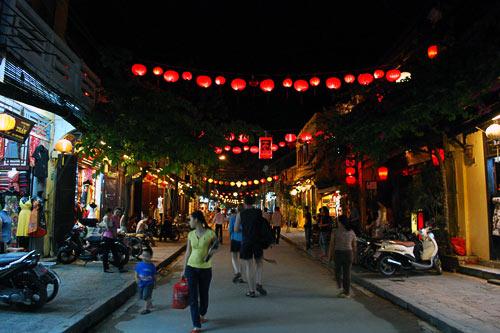 Lanterns line Le Loi Street in Hoi An, Vietnam.