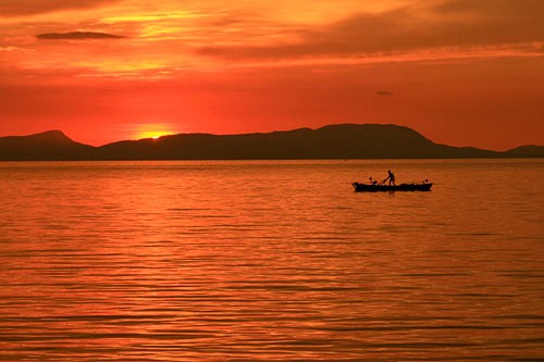 Sunset on the island of Koh Tonsay, Cambodia. Photo by <a href=" http://www.frommers.com/community/user_gallery_detail.html?plckPhotoID=59adb085-cb4a-45aa-b002-8bf41274dea7&plckGalleryID=c0482941-0d2d-4cca-b8c4-809ee9e20c72" target="_blank">c3peat</a>