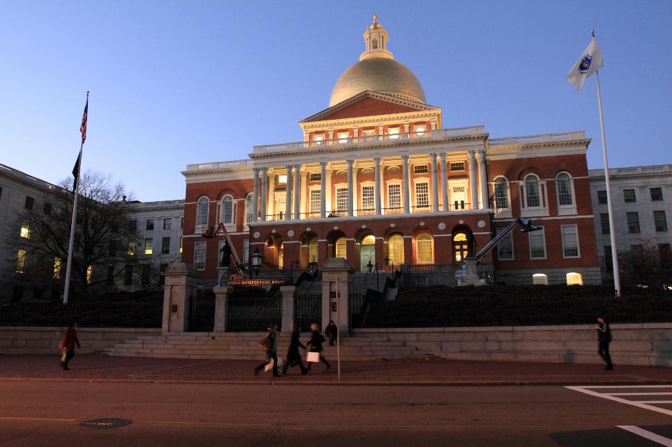 The Massachusetts State House lit up at dusk in Boston, Massachusetts.