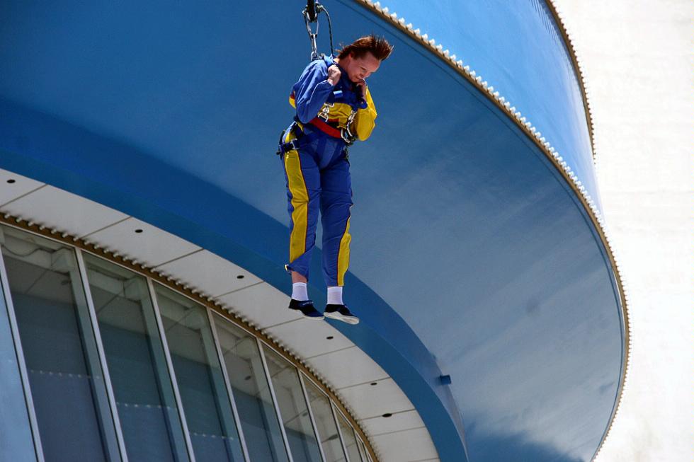 A visitor leaping off the Stratosphere Tower at its SkyJump feature.