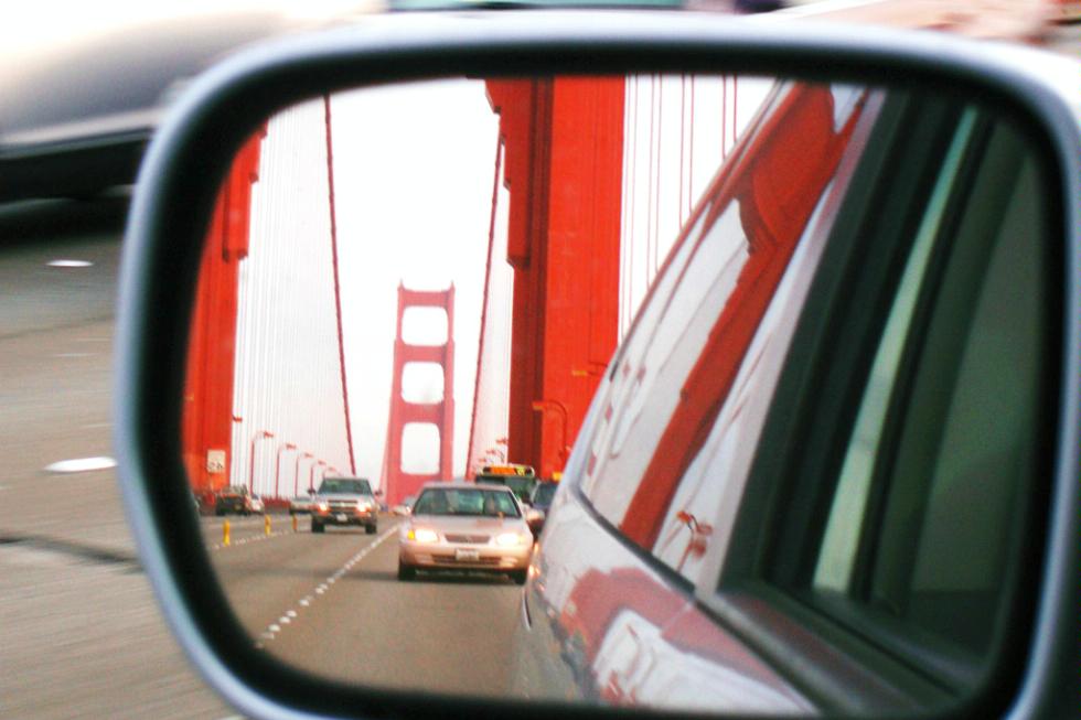 A reflection of the Golden Gate Bridge in a rearview mirror. San Francisco, California.