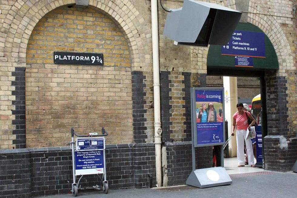 Harry Potter fans can visit Platform 9 3/4 at the Kings Cross Railway Station in London, England.