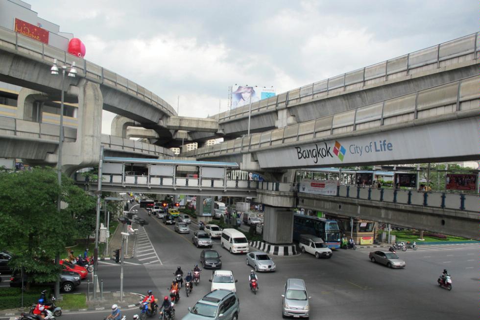 Intersecting Skytrain tracks high above the Bangkok traffic.