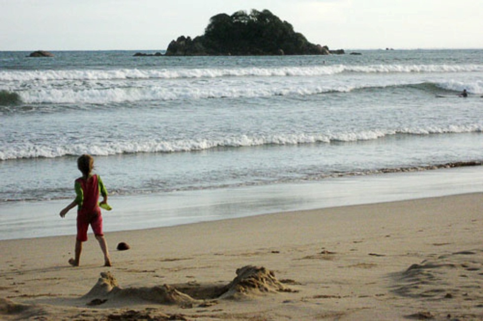 Child playing along the the beach at Weligama in Sri Lanka.