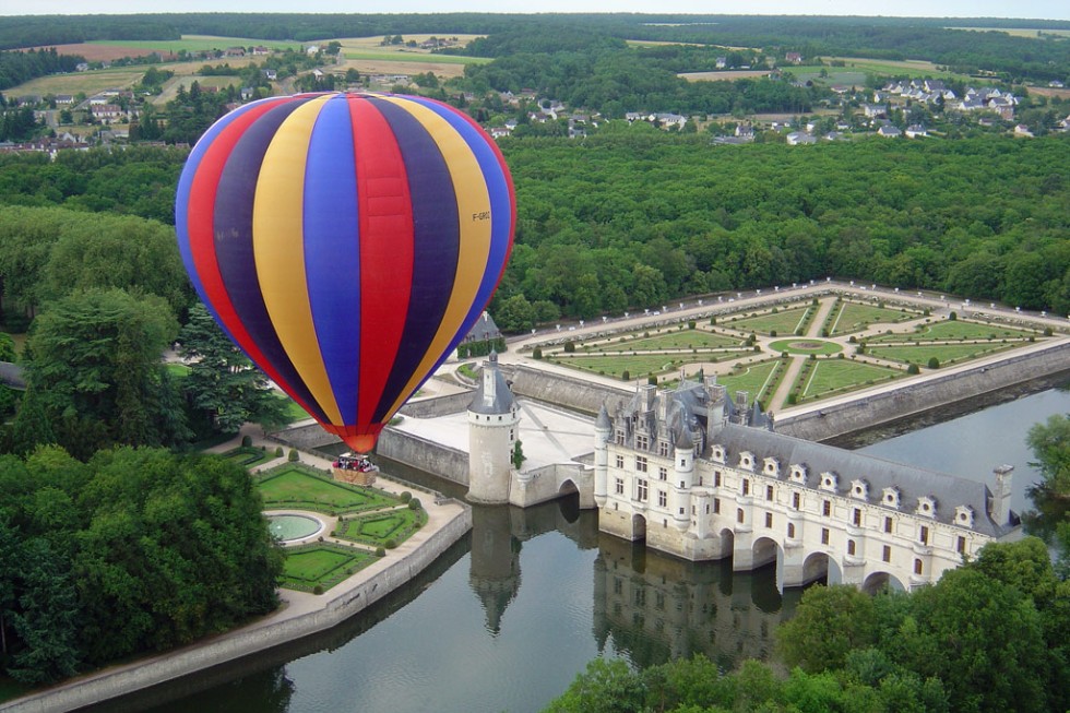 Balloon rising over Chateau de Chenonceau, Loire Valley, France.