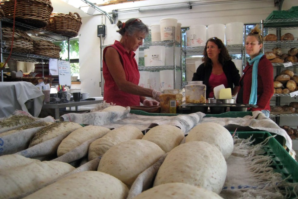 The "Bread Lady" Heather Campbell (left) seasons bread in her shop.