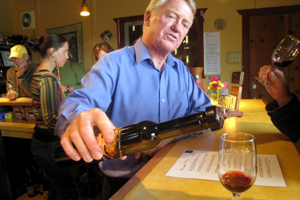 Salt Spring Vineyards owner Dev McIntyre offers a tasting of the blackberry port.