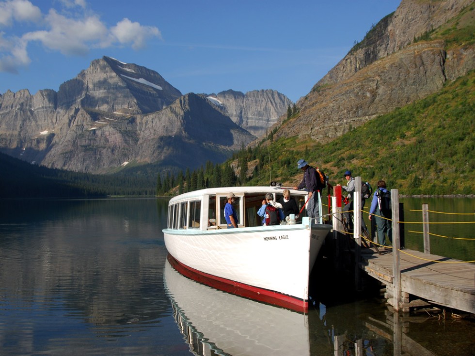 A boat sets off at Many Glacier Hotel, Glacier Bay National Park.