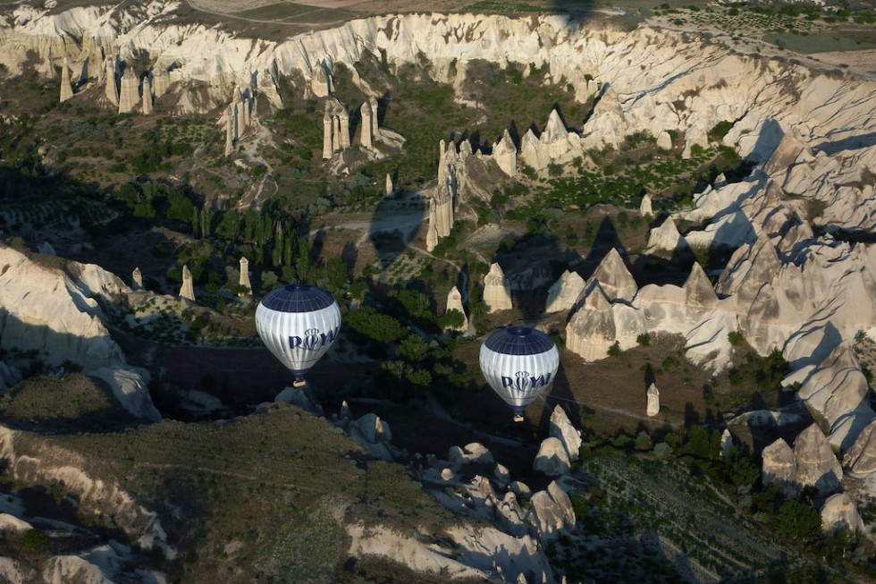 Hot air balloons over the otherworldly landscape of Cappadocia, Turkey.