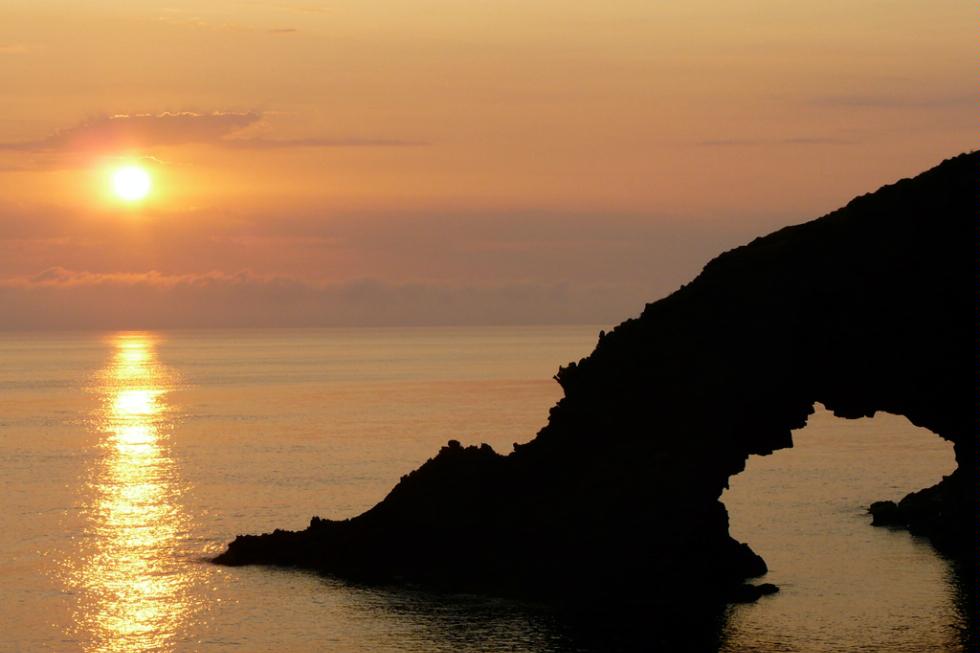 Sunset at Alba all'Arco dell'Elefante on the island of Pantelleria, Sicily.