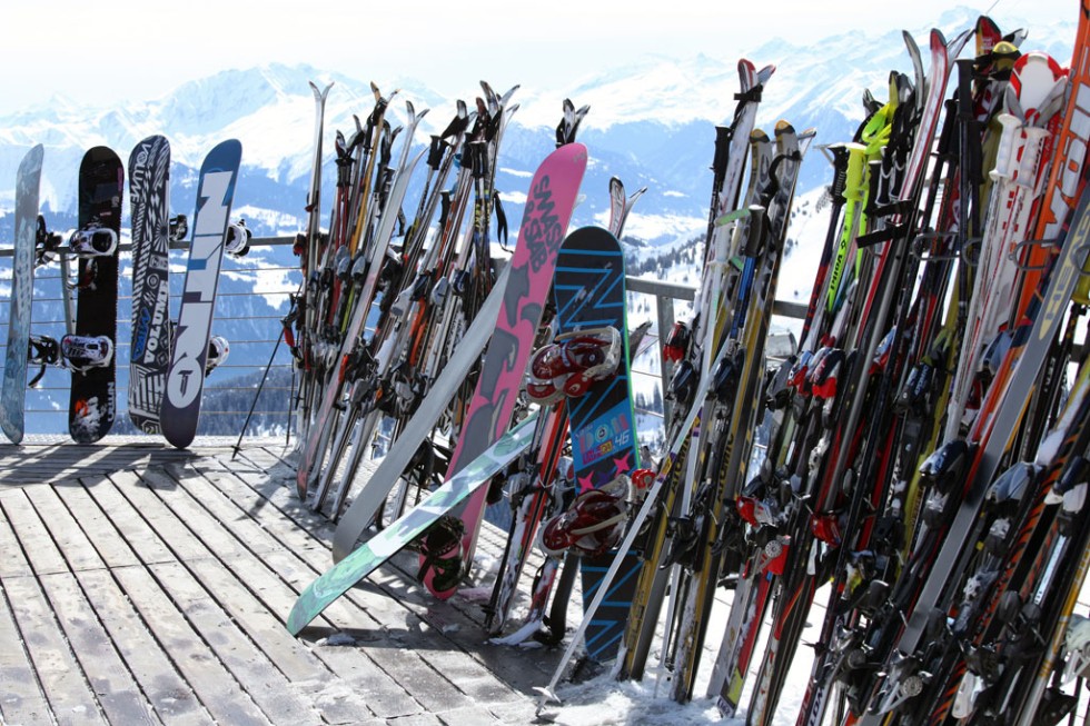Skis and snowboards at winter resort in Laax, Switzerland.